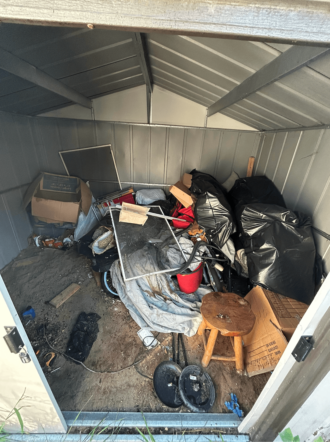 Cypress garage cleared out and swept by Extractors Junk Removal