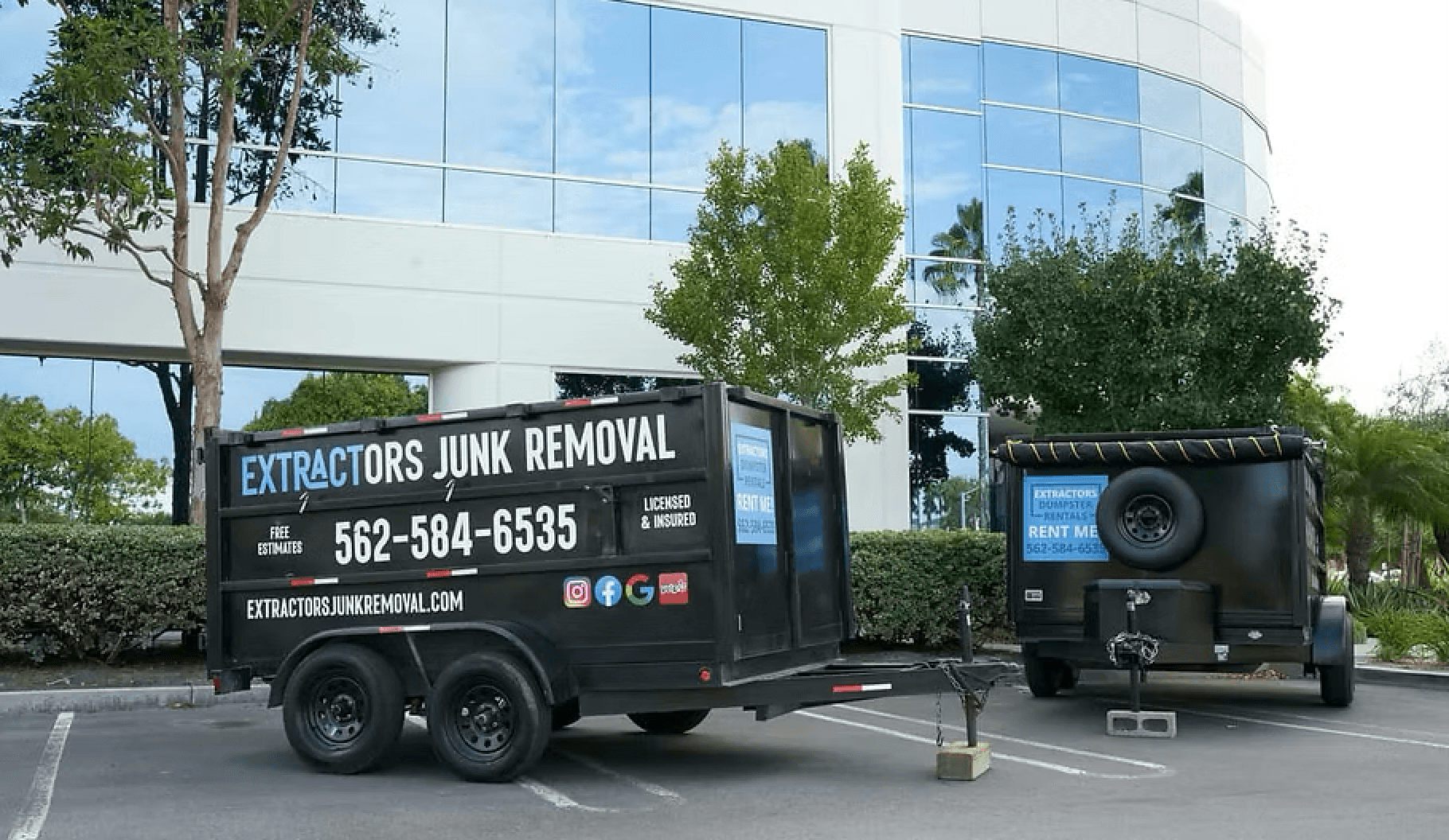 Extractors Junk Removal dumpster trailer dropped in a driveway